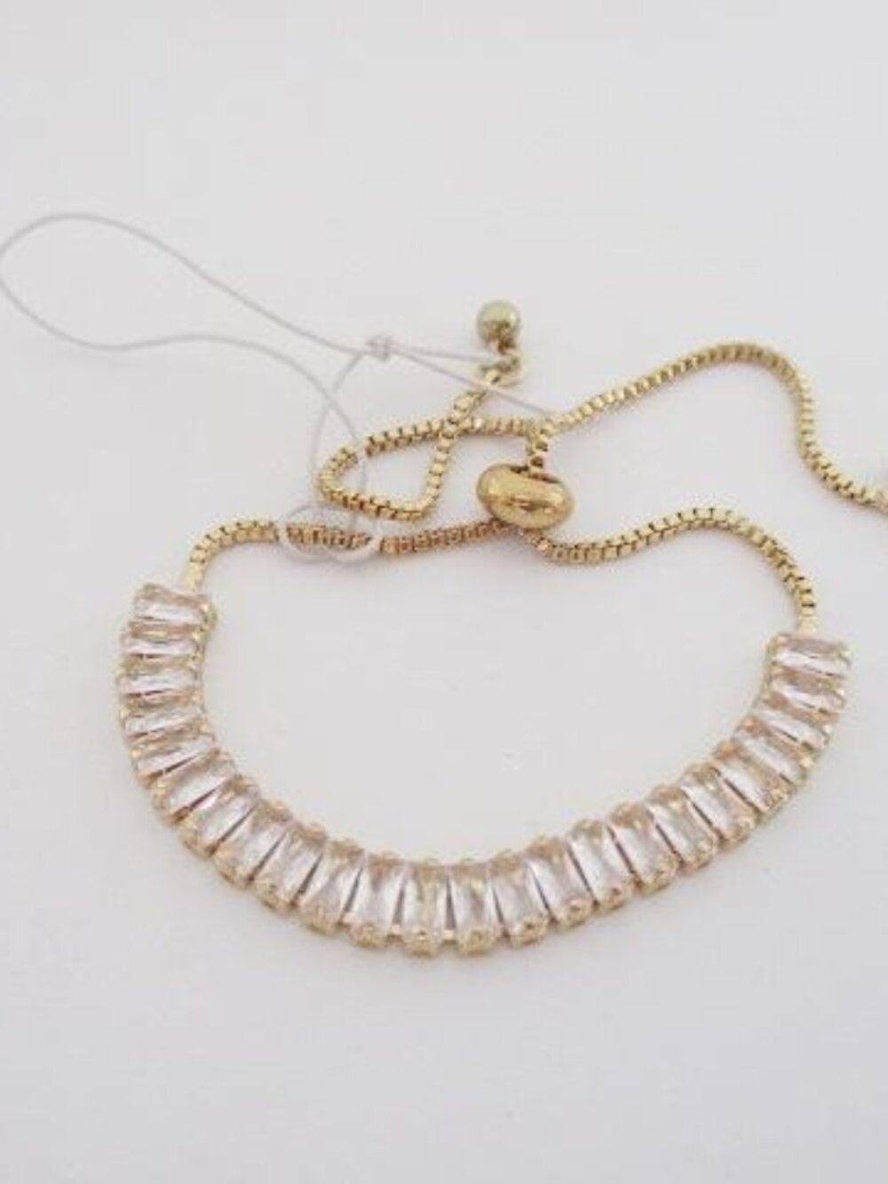 Gold Tone Baguette Crystal Adjustable Tennis Bracelet